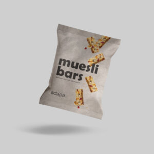 web-optimised-paperflow_muesli bars A light beige, textured paper-based pillow pouch packaging floating at an angle against a solid light gray background. The front features the text "muesli bars" in a large, dark brown font, accompanied by the tagline "Whatever you need, we've got it!" just below. Illustrations of several muesli granola bars are shown tumbling down the front of the pouch, and the dark brown "adapa" brand logo sits in the bottom-left corner.
